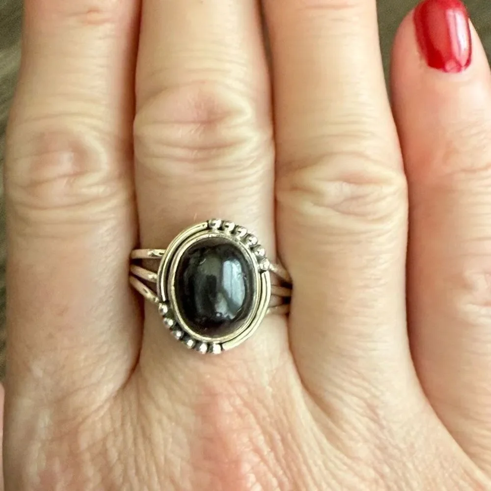 Bold Elegance: Handcrafted Sterling Silver Ring with Oval Black Star Diopside